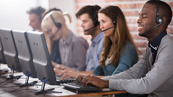 Young customer service representatives on headset